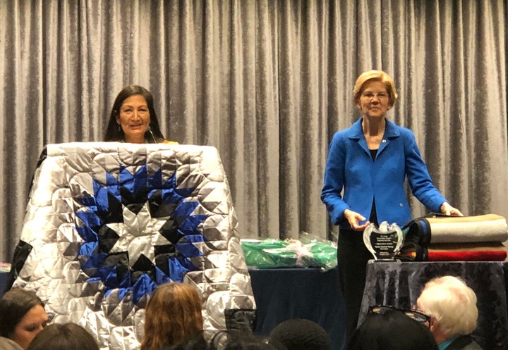 Rep. Deb Haaland (D-N.M.) introducing Sen. Elizabeth Warren (D-Mass.) at the National Indian Women’s “Supporting Each Other” lunch.