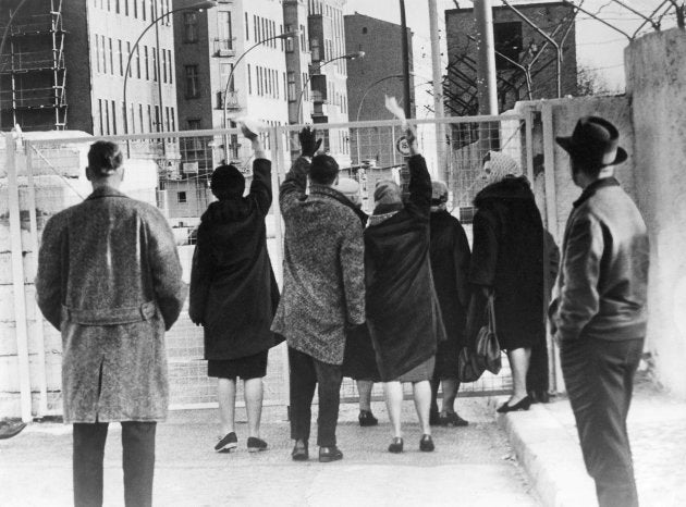 West-Berlin citizens at the border crossing at Chausseestrasse in Wedding. August 1961 (Photo by Alex Waidmann/ullstein bild via Getty Images)