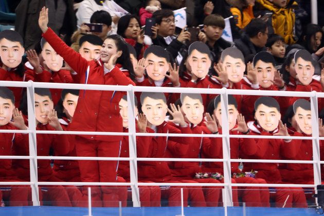 GANGNEUNG, SOUTH KOREA - FEBRUARY 10: North Korean cheerleaders sing and wave during the Women's Ice Hockey Preliminary Round - Group B game between Switzerland and Korea on day one of the PyeongChang 2018 Winter Olympic Games at Kwandong Hockey Centre on February 10, 2018 in Gangneung, South Korea. (Photo by Ronald Martinez/Getty Images)