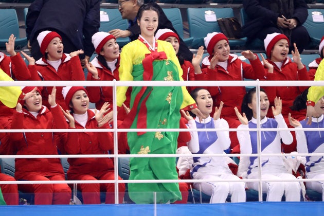 GANGNEUNG, SOUTH KOREA - FEBRUARY 10: North Korean cheerleaders sing and wave during the Women's Ice Hockey Preliminary Round - Group B game between Switzerland and Korea on day one of the PyeongChang 2018 Winter Olympic Games at Kwandong Hockey Centre on February 10, 2018 in Gangneung, South Korea. (Photo by Ronald Martinez/Getty Images)