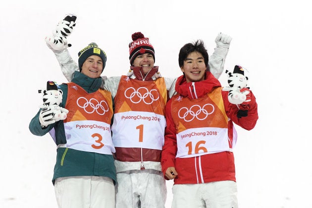 PYEONGCHANG-GUN, SOUTH KOREA - FEBRUARY 12: (L-R) Silver medalist Matt Graham of Australia, gold medalist Mikael Kingsbury of Canada and bronze medalist Daichi Hara of Japan pose during the victory ceremony for the Freestyle Skiing Men's Moguls Final on day three of the PyeongChang 2018 Winter Olympic Games at Phoenix Snow Park on February 12, 2018 in Pyeongchang-gun, South Korea. (Photo by David Ramos/Getty Images)