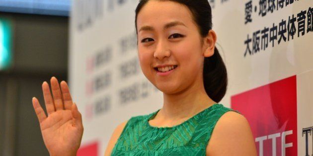 Japan's figure skating world champion Mao Asada waves after a press conference for the upcoming ice show 'The Ice' in Tokyo on May 19, 2014. Asada will sit out competitive figure skating next season but will take part in potentially lucrative commercial ice shows in the coming months. Asada won her third women's world figure skating title in March before a roaring home crowd, springing back from a disappointing result at the Sochi Olympics in February. AFP PHOTO / Yoshikazu TSUNO (Photo credit should read YOSHIKAZU TSUNO/AFP/Getty Images)