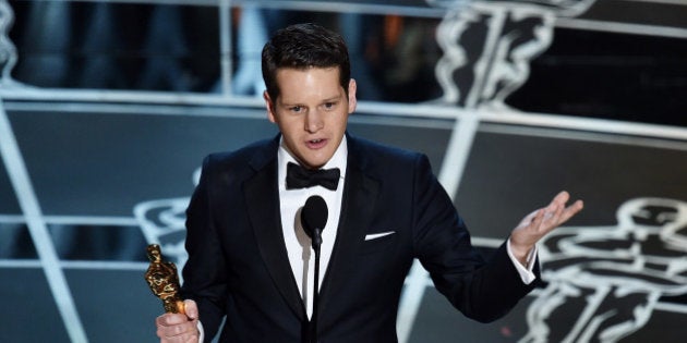 HOLLYWOOD, CA - FEBRUARY 22: Screenwriter Graham Moore accepts the Best Adapted Screenplay Award for 'The Imitation Game' onstage during the 87th Annual Academy Awards at Dolby Theatre on February 22, 2015 in Hollywood, California. (Photo by Kevin Winter/Getty Images)