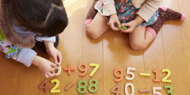 Sisters playing with number blocks, Saitama, Japan