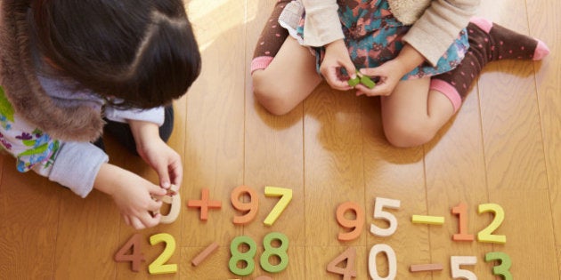 Sisters playing with number blocks, Saitama, Japan