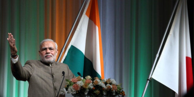 Narendra Modi, India's prime minister, gestures as he speaks at a seminar hosted by Nikkei Inc. and Japan External Trade Organization (JETRO) in Tokyo, Japan, on Tuesday, Sept. 2, 2014. Prime Minister Narendra Modi and his Japanese counterpart Shinzo Abe at a summit meeting in Tokyo yesterday agreed to elevate ties to a special strategic and global partnership. Photographer: Tomohiro Ohsumi/Bloomberg via Getty Images