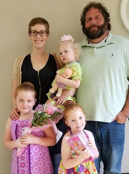 Dina Zirlott in 2018 with her husband, Lance, and their daughters, Aine (7), Ariadne (5) and Asher (3).