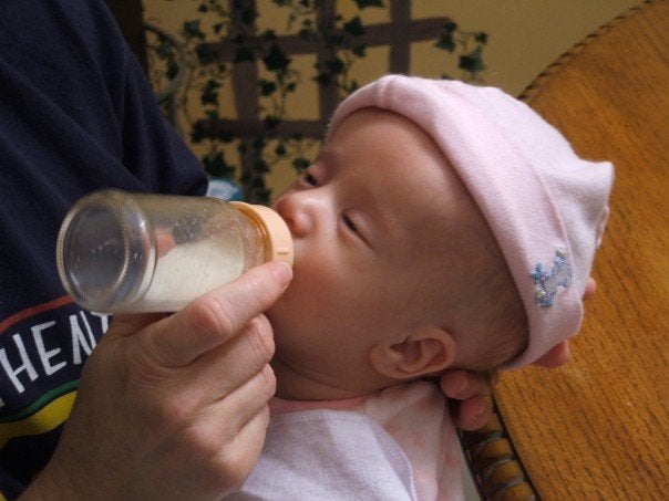 Trying to feed Zoe her first night at home.