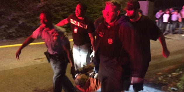 A passenger is carried following an Amtrak train crash Tuesday, May 12, 2015, near Philadelphia. Train...