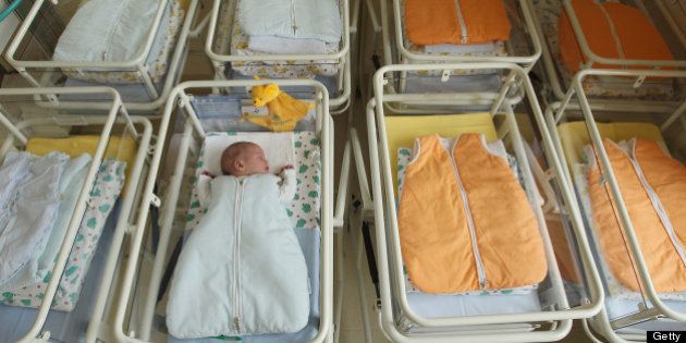 UNDISCLOSED, GERMANY - AUGUST 12: A 4-day-old newborn baby, who has been placed among empty baby beds by the photographer, lies in a baby bed in the maternity ward of a hospital (a spokesperson for the hospital asked that the hospital not be named) on August 12, 2011 in a city in the east German state of Brandenburg, Germany. According to data released by Eurostat last week Germany, with 8.3 births per 1,000 people, has the lowest birth rate in all of Europe. Eastern Germany, which not only suffers from a low birth rate, also has a declining population due to young people moving away because of high unemployment in the region. Europe as a whole suffers from a low birth rate and a growing elderly population. (Photo by Sean Gallup/Getty Images)