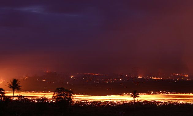 KAPOHO, HI - MAY 19: A lava flow from a Kilauea volcano fissure is blurred as it advances in a long exposure on Hawaii's Big Island on May 19, 2018 in Kapoho, Hawaii. The U.S. Geological Survey said the volcano erupted explosively on May 17 launching a plume about 30,000 feet into the sky. (Photo by Mario Tama/Getty Images)