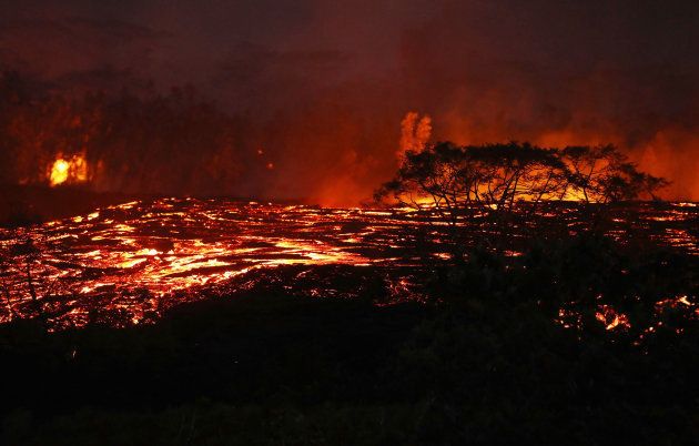 KAPOHO, HI - MAY 18: Lava from a Kilauea volcano fissure flows on Hawaii's Big Island on May 18, 2018 in Kapoho, Hawaii. The U.S. Geological Survey said the volcano erupted explosively on May 17 launching a plume about 30,000 feet into the sky. (Photo by Mario Tama/Getty Images)