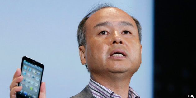 Masayoshi Son, president of SoftBank Corp., introduces the company's Aquos Phone Xx 206SH smartphone, manufactured by Sharp Corp., during a product launch in Tokyo, Japan, on Tuesday, May 7, 2013. Son will visit the U.S. to meet with Sprint Nextel Corp. institutional investors to discuss the company's proposed takeover, SoftBank spokesman Mitsuhiro Kurano said today. Photographer: Kiyoshi Ota/Bloomberg via Getty Images