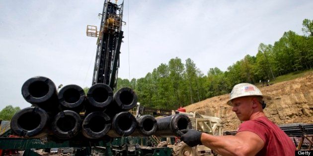 Brian Lairson prepares drill pipe as a shale-gas well is drilled in Mannington, West Virginia, U.S., on Friday, April 30, 2010. This well was being drilled into the Marcellus Shale, a formation that may hold 262 trillion cubic feet of recoverable natural gas, making it the largest known deposit according to a U.S. Energy Department estimate. Photographer: Ty Wright/Bloomberg via Getty Images