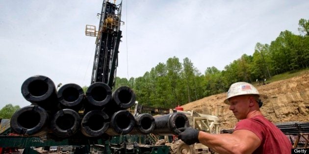 Brian Lairson prepares drill pipe as a shale-gas well is drilled in Mannington, West Virginia, U.S., on Friday, April 30, 2010. This well was being drilled into the Marcellus Shale, a formation that may hold 262 trillion cubic feet of recoverable natural gas, making it the largest known deposit according to a U.S. Energy Department estimate. Photographer: Ty Wright/Bloomberg via Getty Images