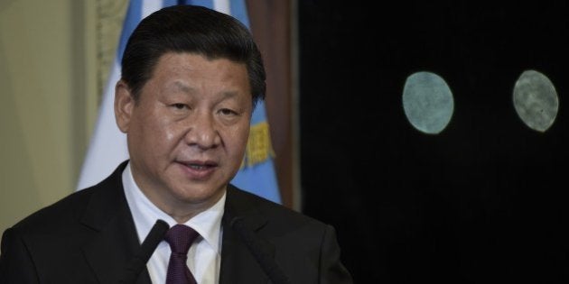 China's President Xi Jinping talks during a press conference next to Argentine President Cristina Fernandez de Kirchner (out of frame) after a meeting at the Government Palace in Buenos Aires on July 18, 2014. AFP PHOTO / Juan Mabromata (Photo credit should read JUAN MABROMATA/AFP/Getty Images)