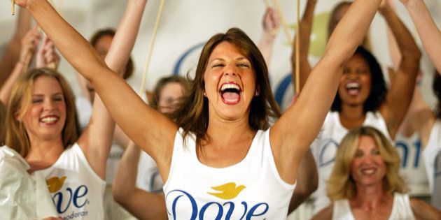 NEW YORK - JULY 2: America's Most Beautiful Underarms Contest winner Nikki Bohannon (C) of Fort Lauderdale, Florida celebrates as she is announced the champion July 2, 2002 in New York City. The contest judged 50 women representing all 50 states and was sponsored by Dove Deodorant. (Photo by Mario Tama/Gettty Images)