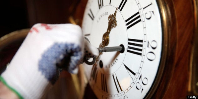 AYLESBURY, ENGLAND - MARCH 22: A clock is wound to the correct time in the West gallery at Waddesdon Manor on March 22, 2013 in Aylesbury, England. The staff at Waddesdon Manor are busy preparing the house and gardens for the spring opening. The light-artist Bruce Munro has also created a new installation in the coach house called Cantus Arcticus. Waddesdon Manor is open to the general public from March 27, 2013 to October 27. (Photo by Matthew Lloyd/Getty Images for Waddesdon Manor)