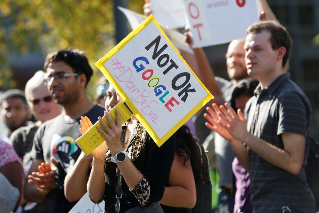 A Google employee holds a sign during a "women's walkout" at their Googleplex offices in protest over the company's handling of a large payout to Android chief Andy Rubin as well as concerns over several other managers who had allegedly engaged in sexual misconduct at the company in Mountain View, California, U.S., November 1, 2018. REUTERS/Stephen Lam