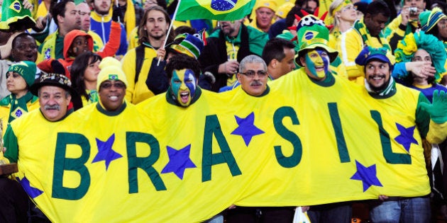 JOHANNESBURG, SOUTH AFRICA - JUNE 20: Brazil fans enjoy the atmosphere prior to the 2010 FIFA World Cup South Africa Group G match between Brazil and Ivory Coast at Soccer City Stadium on June 20, 2010 in Johannesburg, South Africa. (Photo by Stuart Franklin/Getty Images)