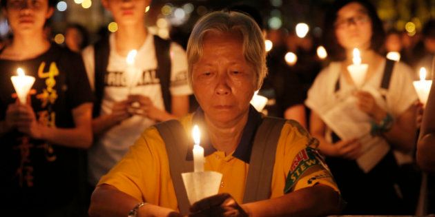 Tens of thousands of people attend a candlelight vigil at Victoria Park in Hong Kong, Saturday, June 4, 2016 to commemorate victims of the 1989 military crackdown in Beijing. China's bloody crackdown on the Tiananmen Square pro-democracy protests was a pivotal moment in the country's political development. Despite the Communist Party's efforts to erase memories of the event, every year its anniversary triggers heightened security and surveillance on the mainland, along with furtive commemorations by a handful of activists. (AP Photo/Kin Cheung)