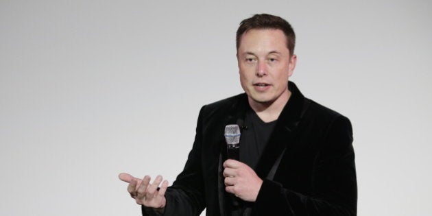 Elon Musk, CEO of Tesla Motors Inc., talks about the Model X car at the company's headquarters Tuesday, Sept. 29, 2015, in Fremont, Calif. (AP Photo/Marcio Jose Sanchez)