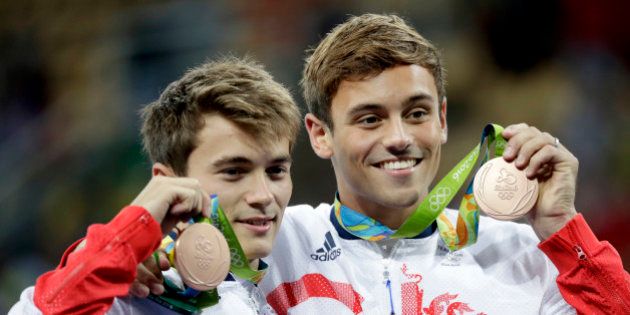 Britain's Tom Daley, right, and Daniel Goodfellow pose with their bronze medals after the men's synchronized 10-meter platform diving final in the Maria Lenk Aquatic Center at the 2016 Summer Olympics in Rio de Janeiro, Brazil, Monday, Aug. 8, 2016. (AP Photo/Matt Dunham)