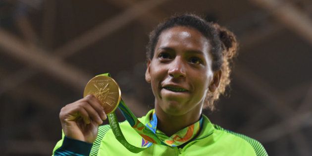 RIO DE JANEIRO, BRAZIL - AUGUST 08: Rafaela Silva of Brazil celebrates after winning the gold medal in the Women's -57 kg Final - Gold Medal Contest on Day 3 of the Rio 2016 Olympic Games at Carioca Arena 2 on August 8, 2016 in Rio de Janeiro, Brazil. (Photo by David Ramos/Getty Images)