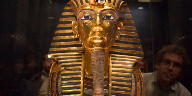 The mask of King Tutankhamun, which was found to have been damaged and glued back together, is seen at the Egyptian Museum in Cairo January 24, 2015. The Egyptian Museum in Cairo acknowledged on Saturday that one of its greatest treasures, the mask of King Tutankhamun, had been crudely glued back together after being damaged, but insisted the item could be restored to its former glory. The golden mask's beard was detached in August, something the museum had not made public until photographs surfaced on the Internet showing a line of glue around its chin, prompting speculation about the damage and questions over whether Egypt was able to care for its priceless artifacts. REUTERS/Shadi Bushra (EGYPT - Tags: SOCIETY TPX IMAGES OF THE DAY)