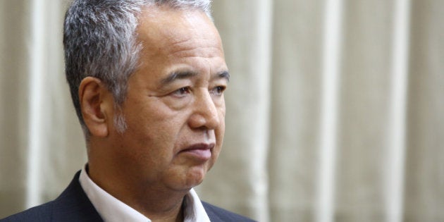 Akira Amari, Japan's economy minister, listens during an interview in Tokyo, Japan, on Thursday, July 2, 2015. Japan still plans to raise the national sales tax again in 21 months, even as the economy struggles to gain momentum following the recession caused by a hike in the levy last year. Photographer: Tomohiro Ohsumi/Bloomberg via Getty Images