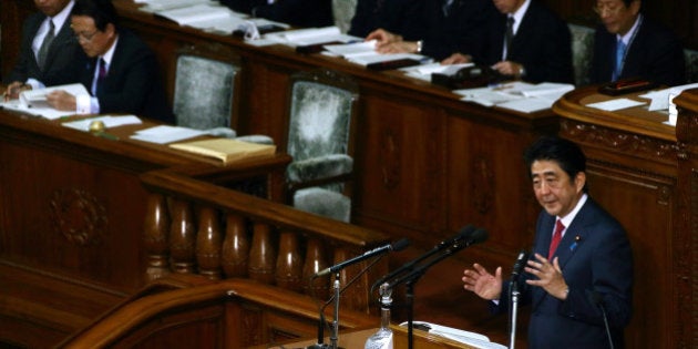 Shinzo Abe, Japan's prime minister, bottom right, delivers his policy speech at the lower house of parliament in Tokyo, Japan, on Thursday, Feb. 12, 2015. Abe said he will press ahead with biggest reforms since World War II. Photographer: Tomohiro Ohsumi/Bloomberg via Getty Images