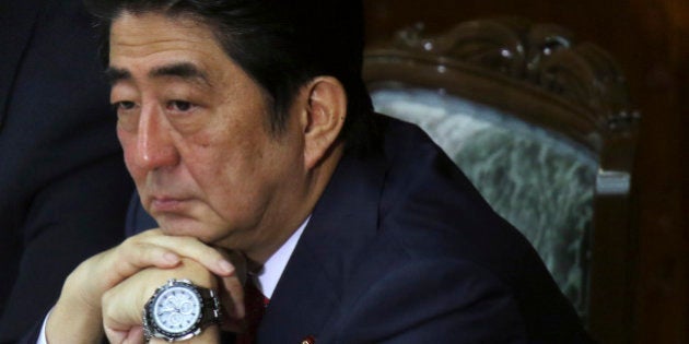 Shinzo Abe, Japan's prime minister, attends a session at the lower house of parliament in Tokyo, Japan, on Thursday, Feb. 12, 2015. Abe said he will press ahead with biggest reforms since World War II. Photographer: Tomohiro Ohsumi/Bloomberg via Getty Images