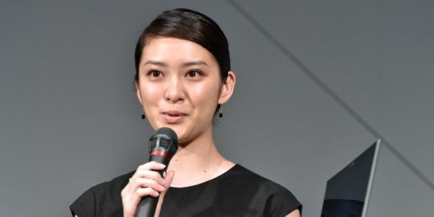 Japanese actress Emi Takei speaks while holding the 'world's lightest notebook computer', with a 13.3-inch display, called the 'Lavie Hybrid Zero', produced by Japan's NEC Personal Computers in Tokyo on May 19, 2015. The lightweight notebook, weighing only 779g (1.7 lbs), is equipped with an Intel's Core i5 processor and a 13.3-inch wide IGZO LCD display. AFP PHOTO / Yoshikazu TSUNO (Photo credit should read YOSHIKAZU TSUNO/AFP/Getty Images)