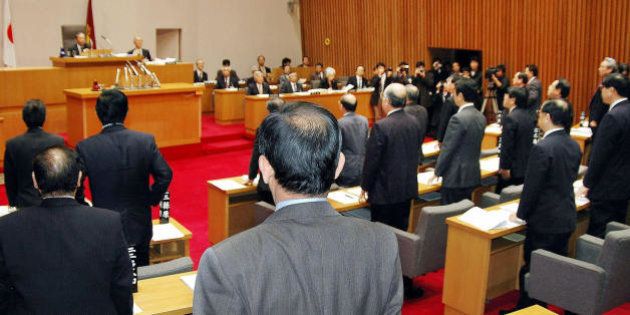 MATSUE, JAPAN: Local Japanese lawmakers of the Shimane Prefectural Assembly stand to pass a bill stressing a claim to a small, uninhabitted island chain controlled by South Korea, 16 March 2005 in Matsue, in Shimane prefecture. The lawmakers enacted an ordinance designating February 22 'Takeshima Day' in honor of the tiny rock islets, rich in fish. They are known as Takeshima in Japanese and Dokdo in Korean. AFP PHOTO (Photo credit should read STR/AFP/Getty Images)