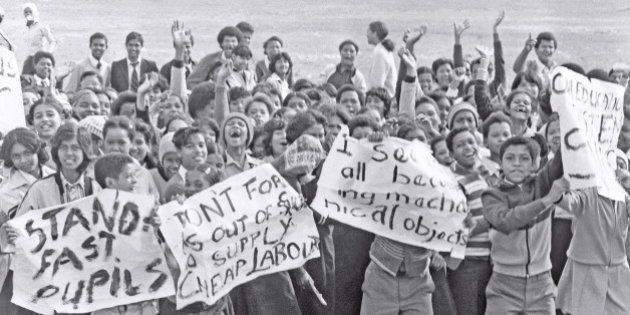 SOUTH AFRICA - 1980's: (SOUTH AFRICA OUT) High school students protesting during the apartheid-era, waving posters and placards around in the 1980's in South Africa. (Photo by Die Burger/Gallo Images/Getty Images)