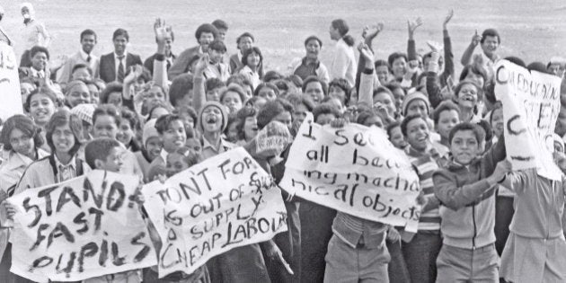 SOUTH AFRICA - 1980's: (SOUTH AFRICA OUT) High school students protesting during the apartheid-era, waving posters and placards around in the 1980's in South Africa. (Photo by Die Burger/Gallo Images/Getty Images)