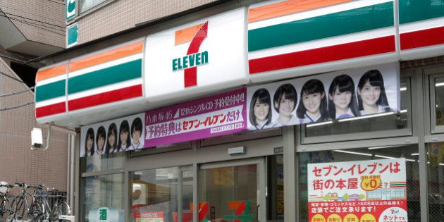 A customer enters a 7-Eleven convenience store, operated by Seven & I Holdings Co., in Tokyo, Japan, on June 30, 2015. Coffee sales at convenience stores surged 48 percent last year, the fastest-growing part of Japan's beverage market, as $1-a-cup brews boosted consumption to a record. Photographer: Kiyoshi Ota/Bloomberg via Getty Images