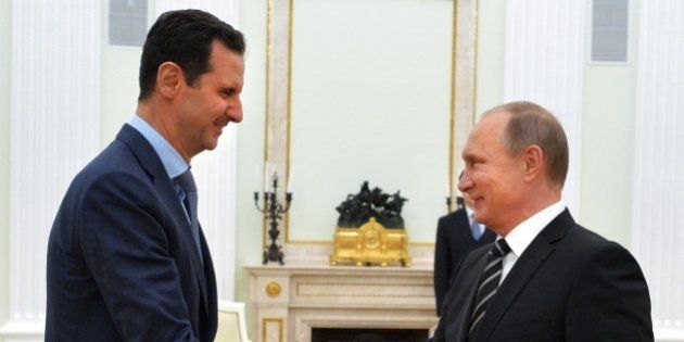 Russian President Vladimir Putin (R) shakes hands with his Syrian counterpart Bashar al-Assad (L) during their meeting at the Kremlin in Moscow on October 20, 2015. Syria's embattled President Bashar al-Assad made a surprise visit to Moscow on October 20 for talks with Russian President Vladimir Putin, his first foreign trip since the conflict erupted in 2011. AFP PHOTO / RIA NOVOSTI / KREMLIN POOL / ALEXEY DRUZHININ (Photo credit should read ALEXEY DRUZHININ/AFP/Getty Images)