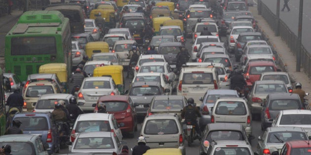 Vehicles sit in traffic on a road shrouded in haze in New Delhi, India, on Monday, Jan. 20, 2014. India, China and Brazil, three of the largest developing nations, joined the U.S. in a list of the biggest historical contributors to global warming, according to a study by researchers in Canada. Photographer: Kuni Takahashi/Bloomberg via Getty Images