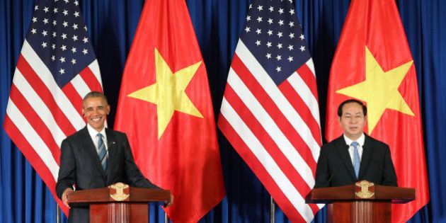 Vietnam's President Tran Dai Quang, right, and US President Barack Obama attend a press conference in Hanoi, Vietnam, Monday, May 23, 2016. Obama on Monday lifted a decades-old arms export embargo for Vietnam during his first visit to the communist country, looking to bolster a government seen as a crucial, though flawed partner even as he pushes for better human rights from the one-party state. (Luong Thai Linh, Pool Photo via AP)