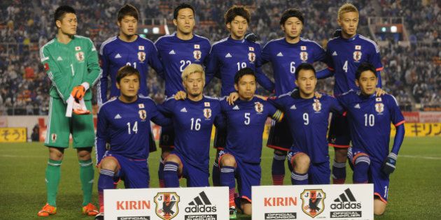 TOKYO, JAPAN - MARCH 05: (EDITORIAL USE ONLY) Japan line up for team photos prior to the Kirin Challenge Cup international friendly match between Japan and New Zealand at National Stadium on March 5, 2014 in Tokyo, Japan. (Photo by Kaz Photography/Getty Images)