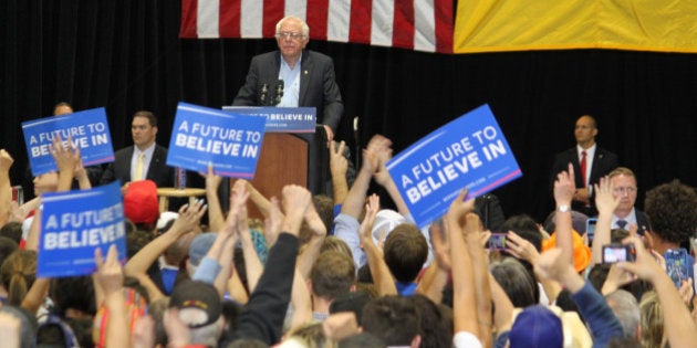 Democratic presidential candidate Bernie Sanders pauses during his speech as the crowd cheers during a rally in Albuquerque, N.M., on Friday, May 20, 2016. (AP Photo/Susan Montoya Bryan)