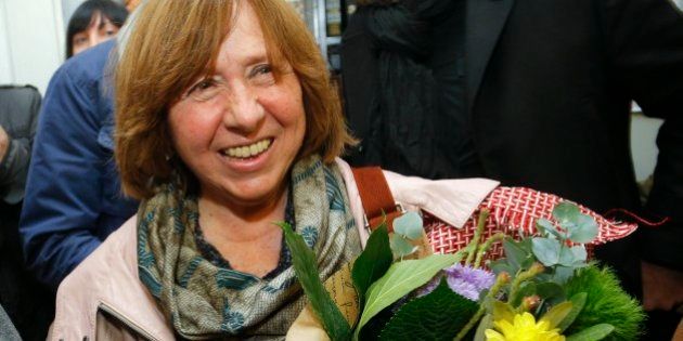 Belarusian journalist and writer Svetlana Alexievich who has been named the 2015 Nobel literature winner, holds flowers as she leaves a news conference in Minsk, Belarus, Thursday, Oct. 8, 2015. Belarusian writer Svetlana Alexievich won the Nobel Prize in literature Thursday, for works that the prize judges called