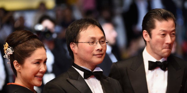 CANNES, FRANCE - MAY 14: (L-R) Japanese actress Tsutsui Mariko, director Koji Fukada and actor Asano Tadanobu attend the screening of the film 'Fuchi ni Tatsu (Harmonium)' ahead of the 'The Handmaiden (Mademoiselle)' premiere during the 69th annual Cannes Film Festival at the Palais des Festivals on May 14, 2016 in Cannes, France. (Photo by Ian Gavan/Getty Images)