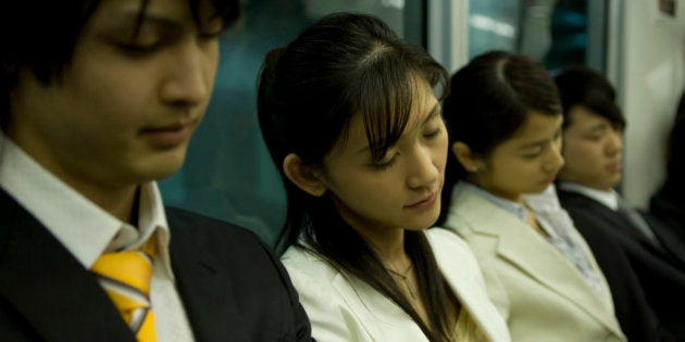 People on the train, sleeping on the seat