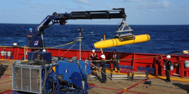 AT SEA - APRIL 1: In this handout image provided by the U.S. Navy, The Bluefin 21, Artemis autonomous underwater vehicle (AUV) is hoisted back on board the Australian Defence Vessel Ocean Shield after successful buoyancy testing April 1, 2014 in the Indian Ocean. Joint Task Force 658 is currently supporting Operation Southern Indian Ocean, searching for the missing Malaysia Airlines flight MH370. The airliner disappeared on March 8 with 239 passengers and crew on board and is suspected to have crashed into the southern Indian Ocean. (Photo by Mass Communication Specialist 1st Class Peter D. Blair/U.S. Navy via Getty Images)