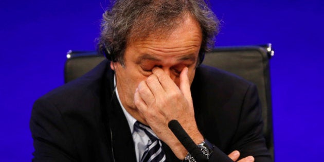 FILE - In this May 24, 2013 file photo UEFA President Michel Platini reacts as he speaks to members of the media at the end of the 37th Ordinary UEFA Congress in London. UEFA leaders were meeting Thursday Oct. 15, 2015 to decide whether to continue backing Michel Platini, with some not yet satisfied by his explanation for a payment that led to his 90-day FIFA suspension. (AP Photo/Sang Tan)