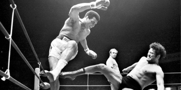 TOKYO, JAPAN: Boxer Muhammad Ali (L) fights with wrestler Antonio Inoki at Nihon Budokan on June 26, 1976 in Tokyo, Japan. (Photo by Sankei Archive/Getty Images)