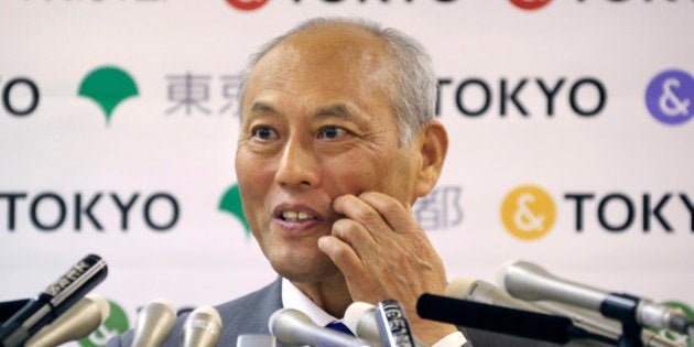 Tokyo Gov. Yoichi Masuzoe answers reporters questions during a press conference in Tokyo, Friday, May 13, 2016. The governor Tokyo has triggered public outrage for flying first-class and staying at up to $1,800-a-night suites in Europe and America during official overseas trips. (AP Photo/Koji Sasahara)