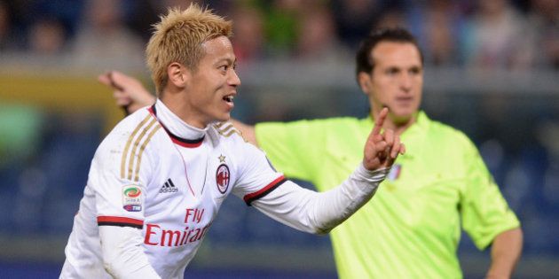 GENOA, ITALY - APRIL 07: Keisuke Honda of AC Milan #10 celebrates scoring the second goal during the Serie A match between Genoa CFC v AC Milan at Stadio Luigi Ferraris on April 7, 2014 in Genoa, Italy. (Photo by Claudio Villa/Getty Images)